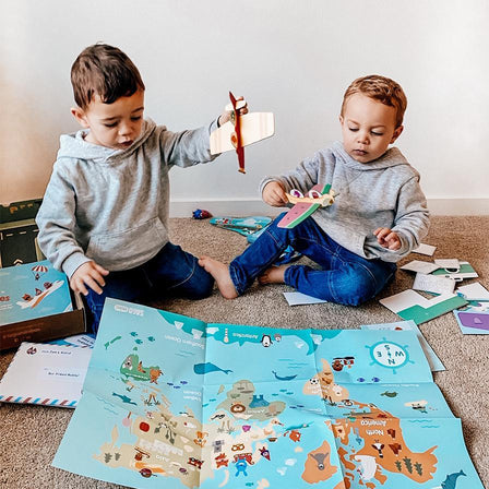 Kid Playing with Planes Box