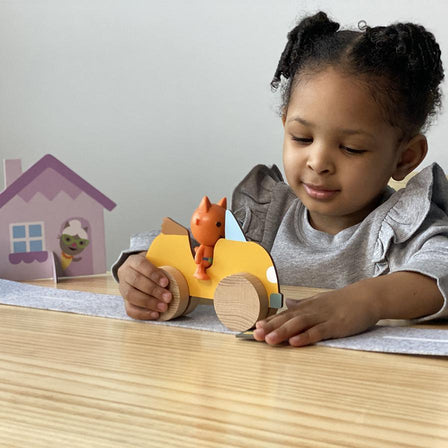 Kid Playing with Fairy Tales Box